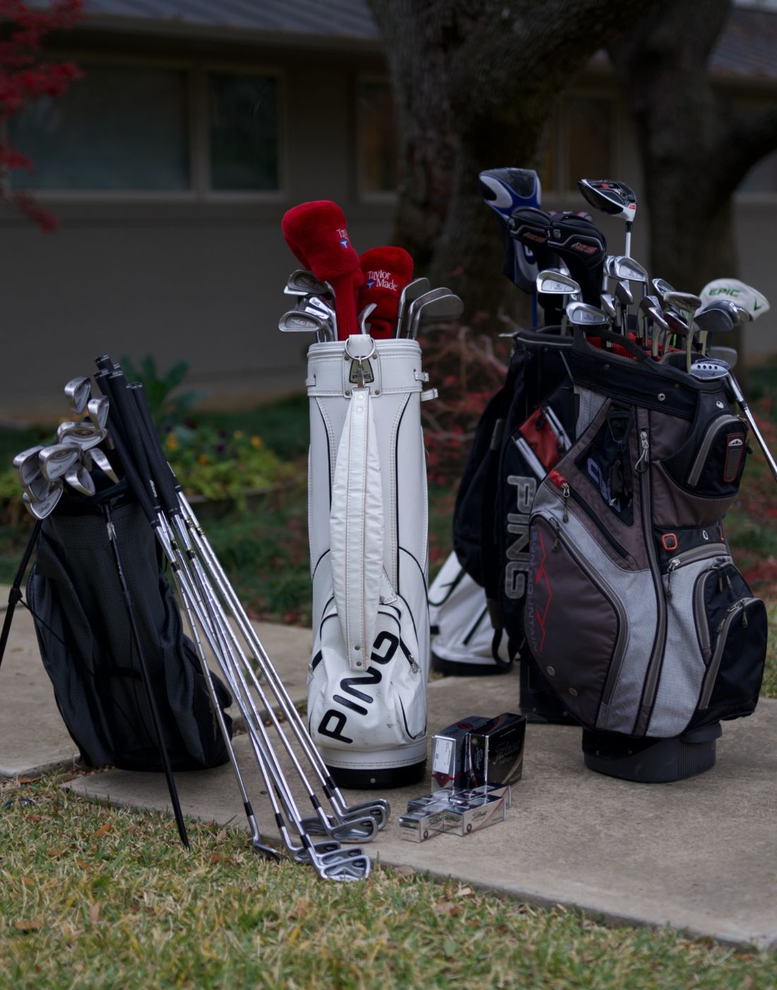 image of golf club full sets standing up in front of a house